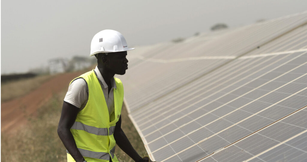 Inspecting solar panels in Senegal