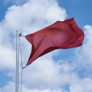 Red flag waving in the wind