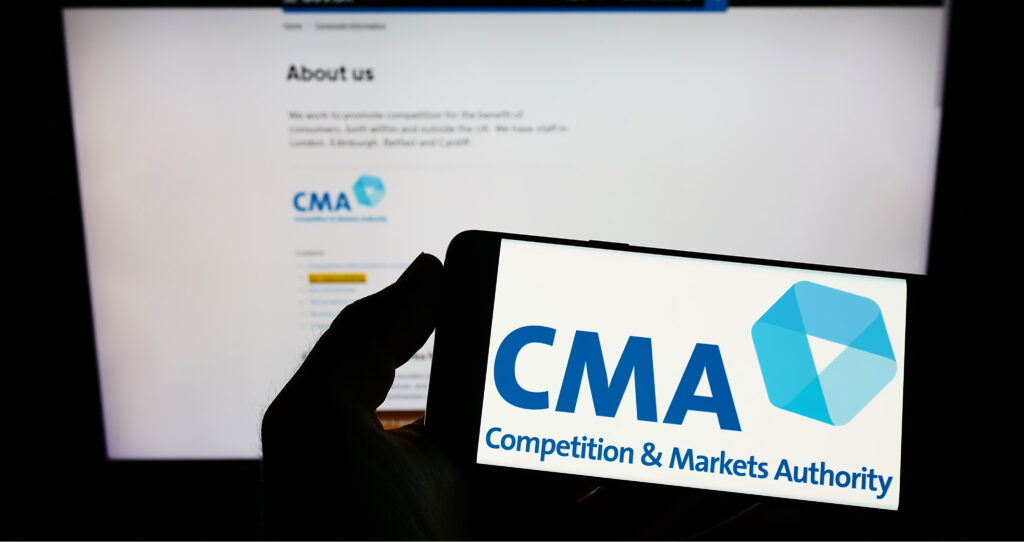 CMA logo in front of screen and website