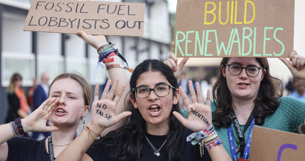 COP28 youth climate activists (Karim Sahib/AFP via Getty Images)