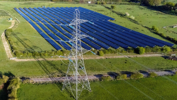Solar panels near electricity pylons UK