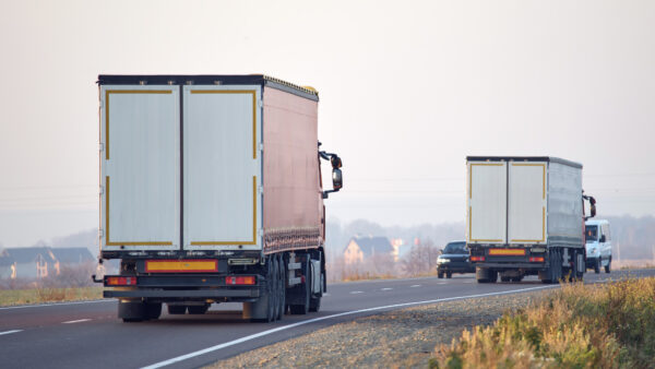Lorries driving on road, Scope 3 emissions