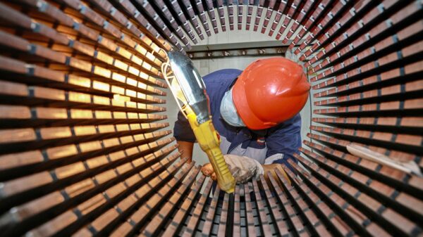 A worker checks a rotor core used for wind turbines at a factory in Nantong, in China’s eastern Jiangsu province